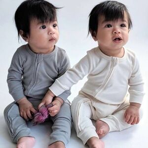 Toey 100% organic cotton Baby Onesies in and Cream one available